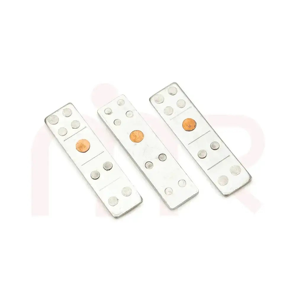 Three silver metal strips with copper inserts for Vastu Shastra remedies.