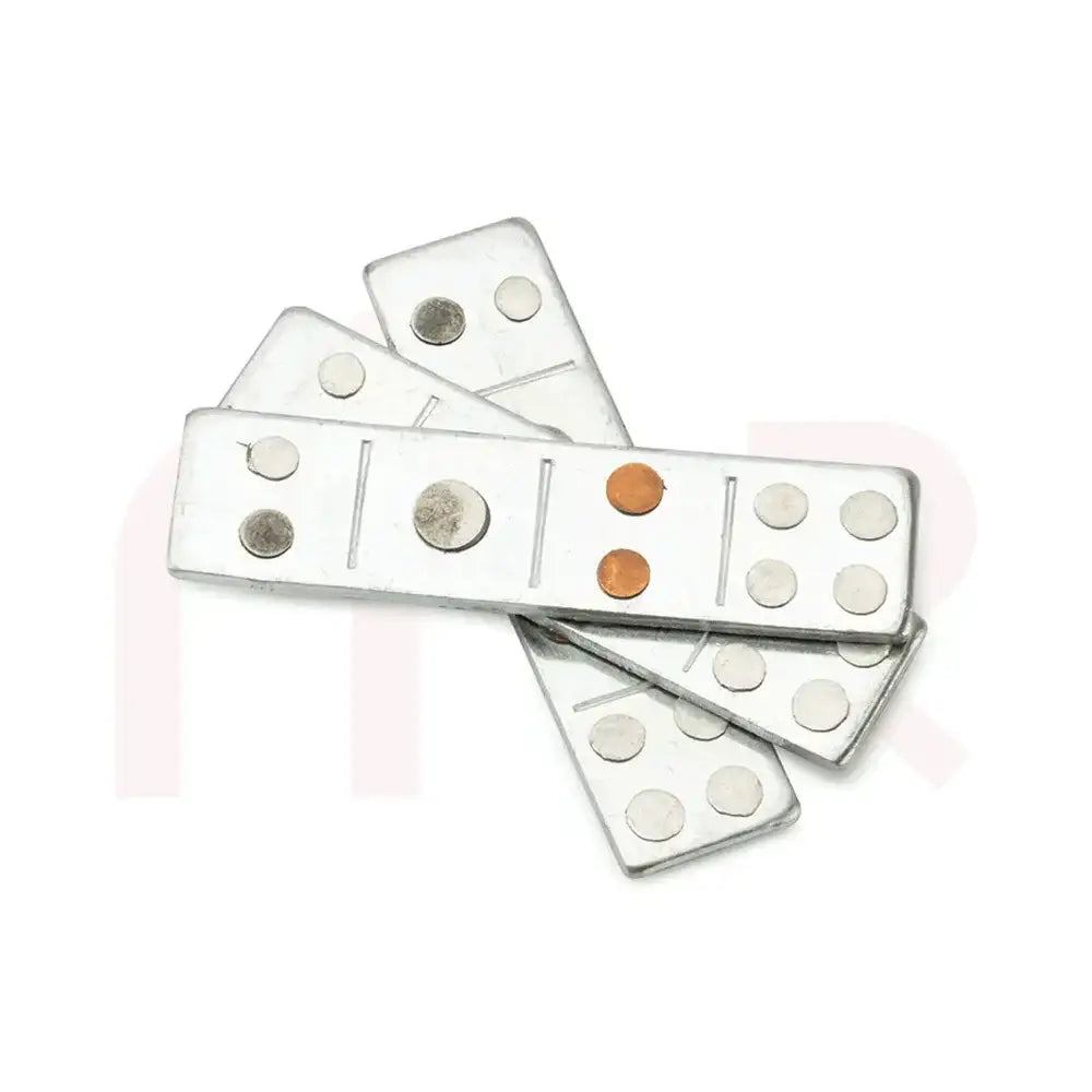 Silver metal strips with embedded copper and metal discs for Vastu remedies.