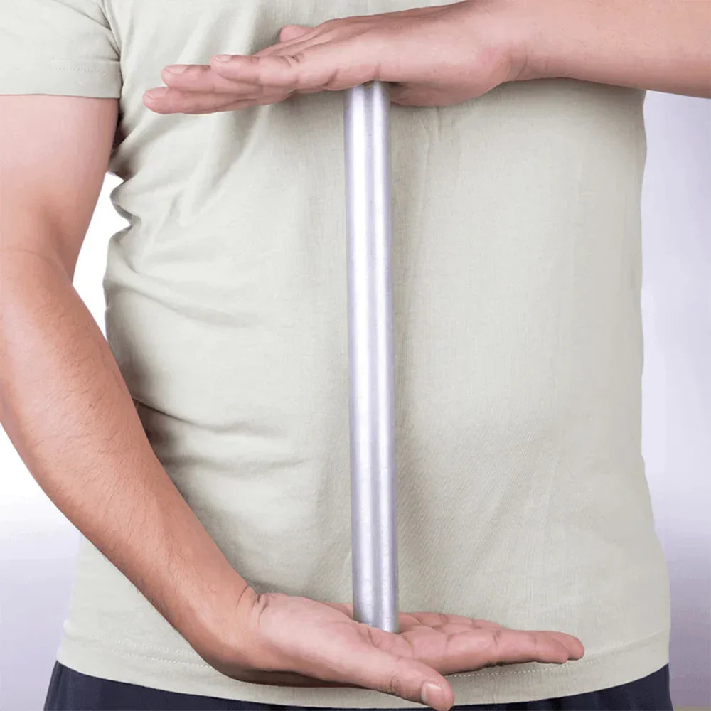 Person holding a straight aluminium rod for MahaVastu Vastu Shastra remedy