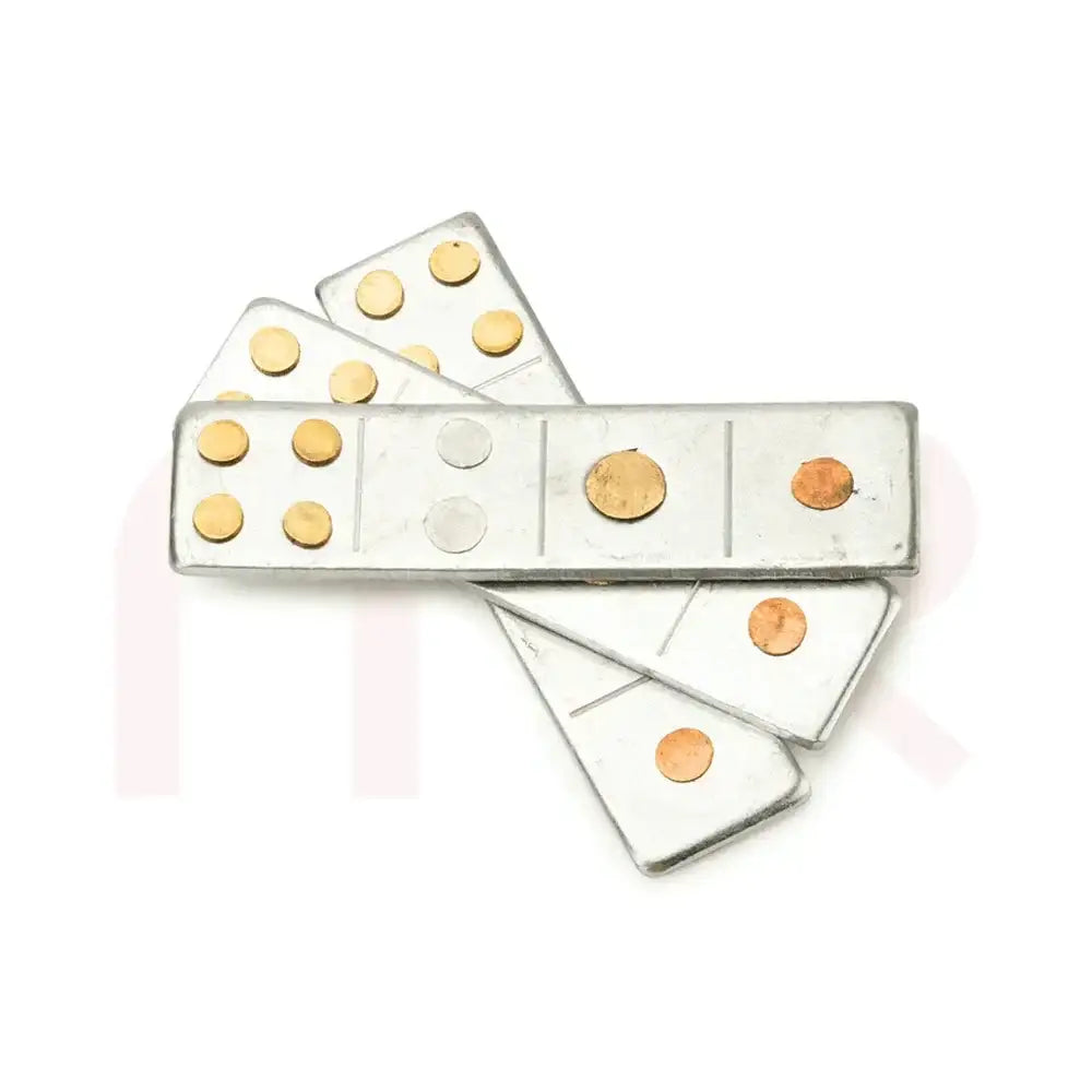 Set of silver metal strips with brass and copper dots for Vastu Shastra remedies.