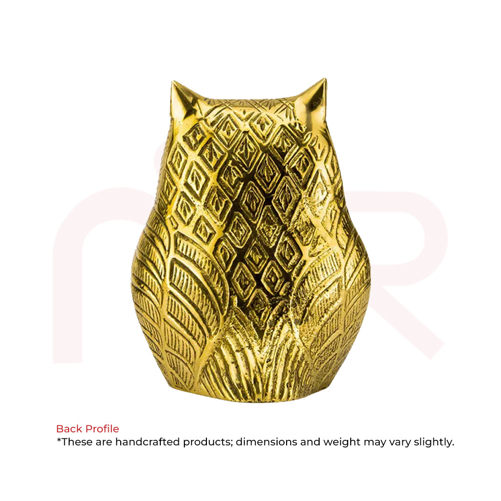 Back view of a golden owl figurine with intricate patterns, Vastu home decor remedy