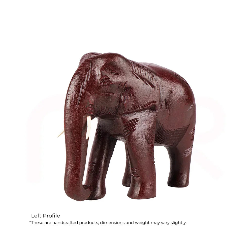 Handcrafted wooden elephant statue, Vastu decor remedy, dark brown finish, left profile