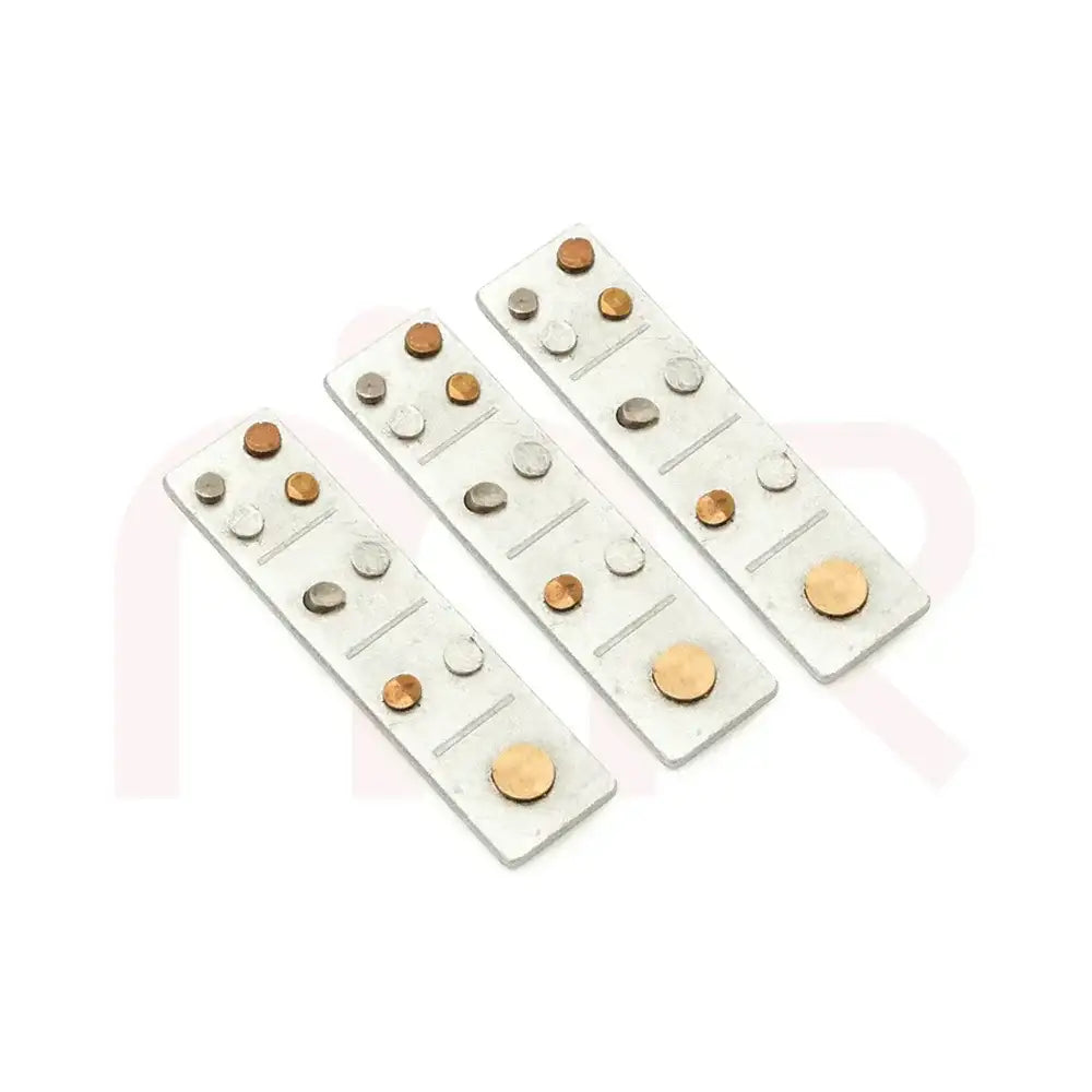 Set of three silver metal strips with embedded copper and silver dots for Vastu remedies.