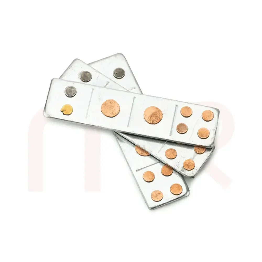 Metal strips with copper and silver dots for Vastu Shastra remedies.