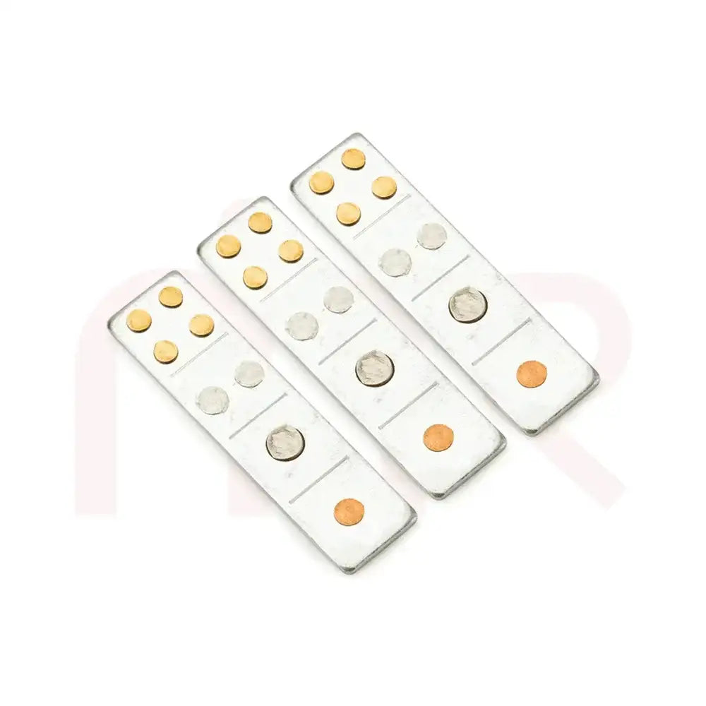 Set of three silver metal strips with brass and copper studs for Vastu remedies.