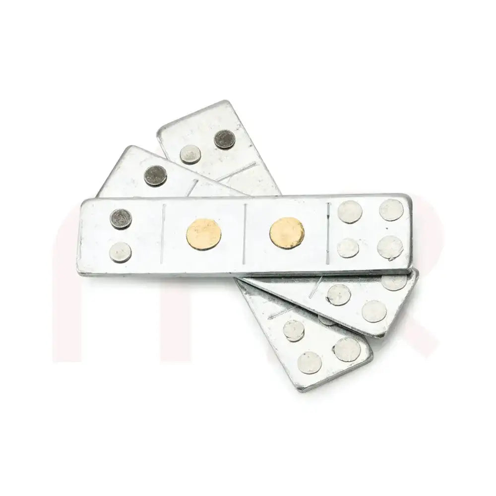 Set of silver metal strips with gold accents for Vastu Shastra remedies.