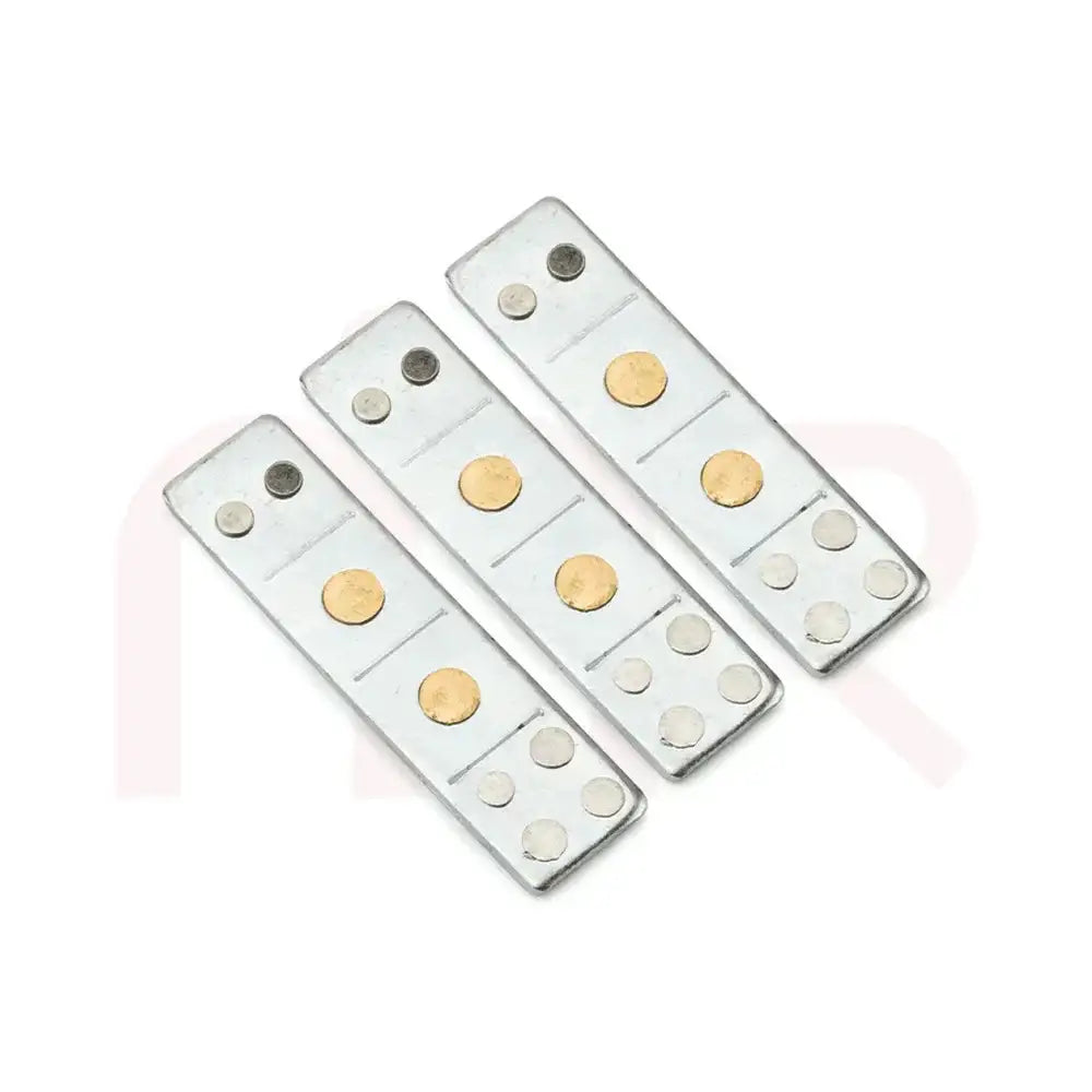 Three silver metal strips with brass dots for Vastu Shastra remedies