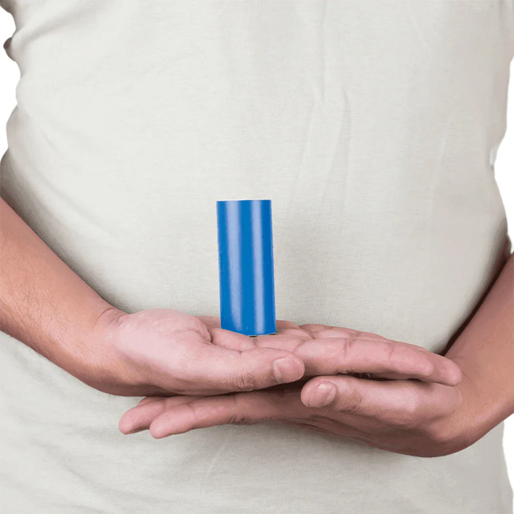 Person holding a roll of blue MahaVastu Vastu remedy color tape in cupped hands