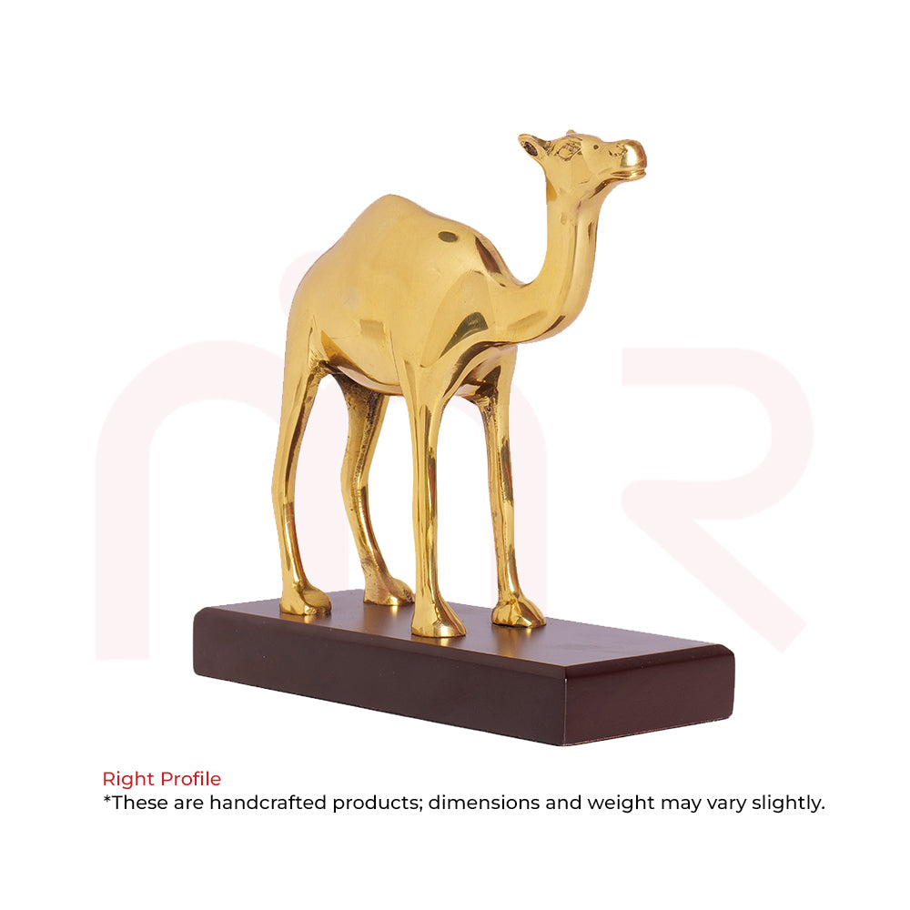 Handcrafted golden camel figurine on a dark base for Vastu Shastra home decor.