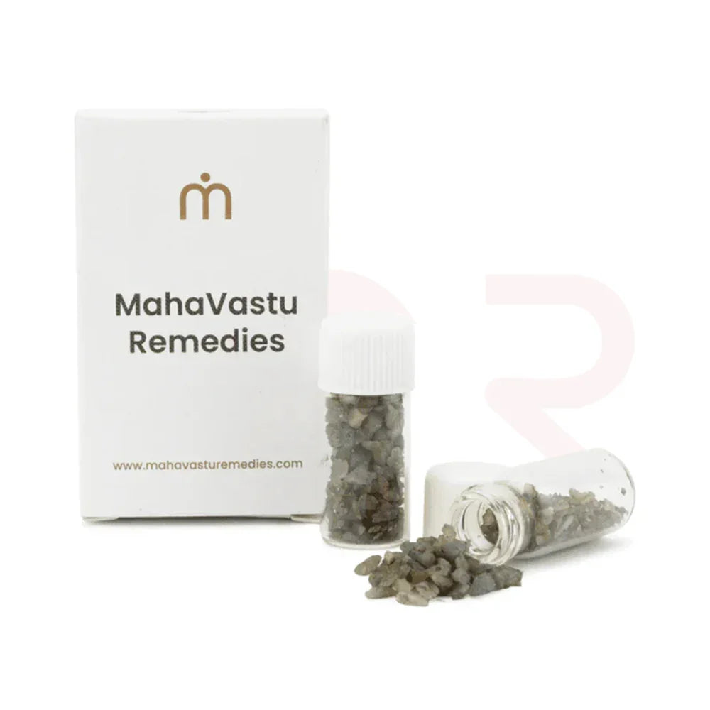 Cat's Eye MahaVastu Remedies stones in small vials beside branded box for Vastu solutions