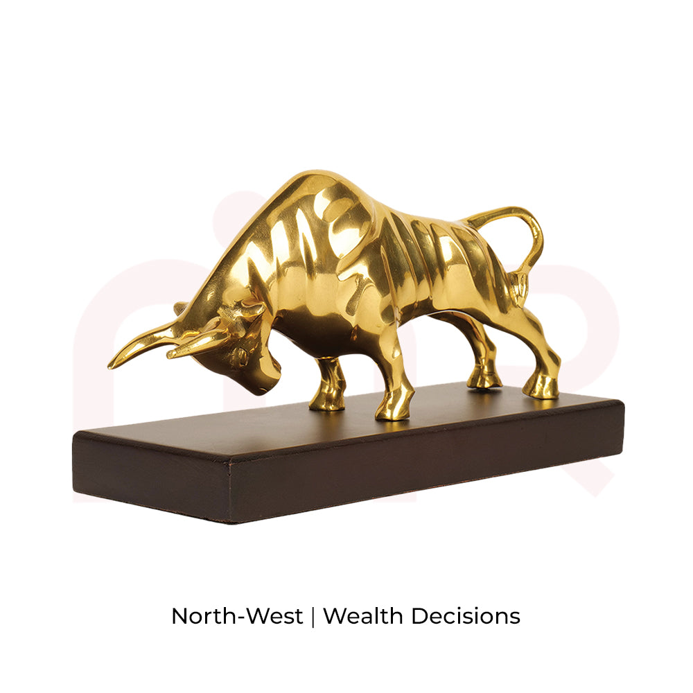 Gold bull statue on dark base, MahaVastu remedy for wealth and prosperity enhancement