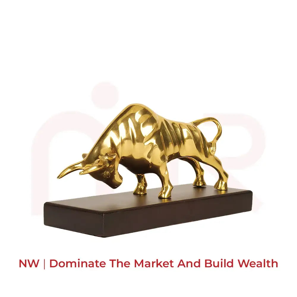 Golden bull statue on a black base for wealth and prosperity in the Northwest direction.