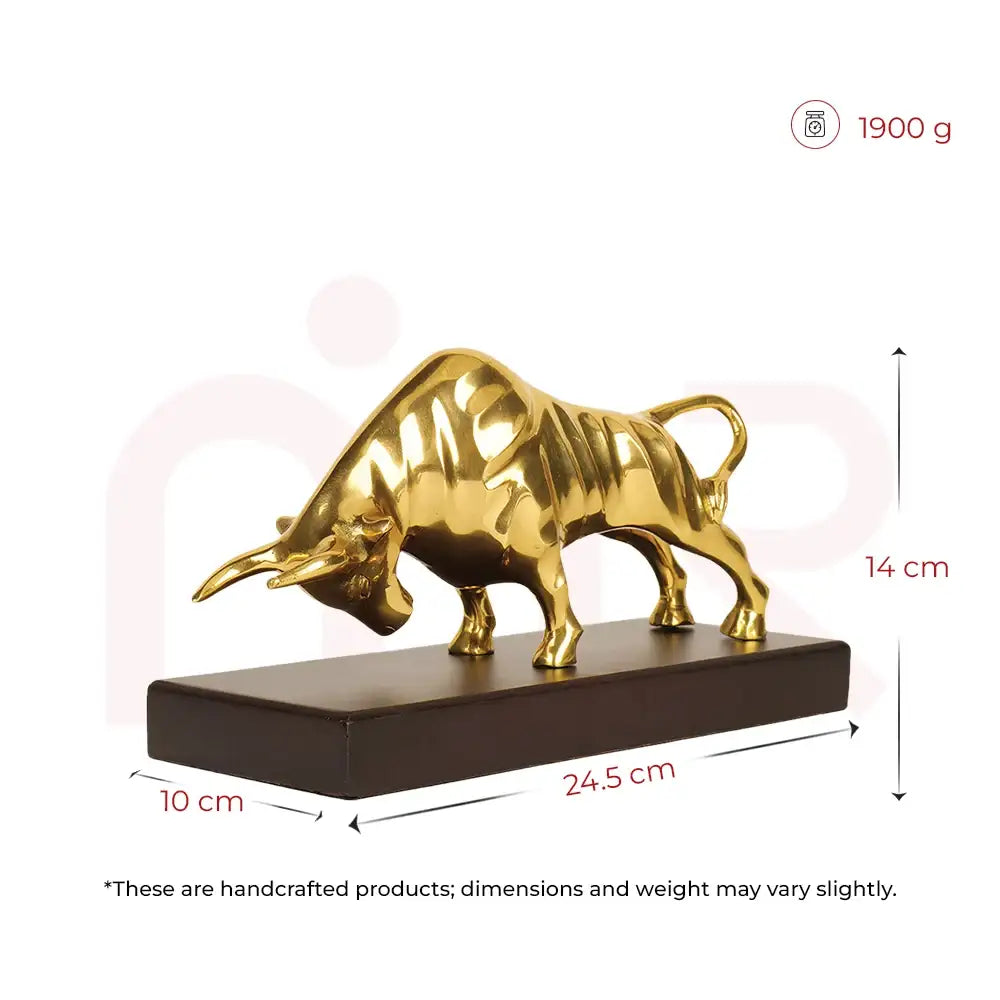 Golden bull statue on a black base, 24.5 cm long, for Vastu prosperity and positive energy.