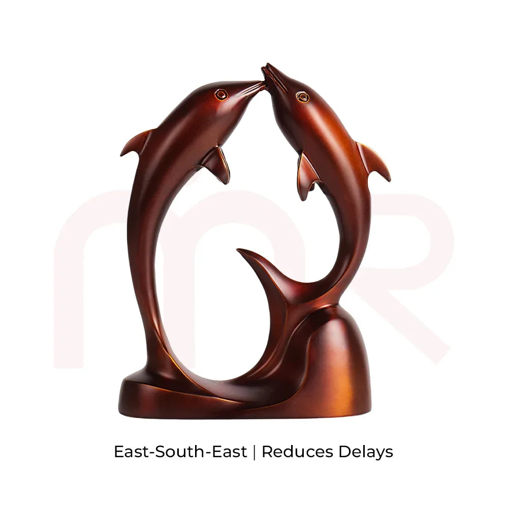 Vastu remedy bronze dancing dolphins statue for harmony, ideal for East-South-East placement.