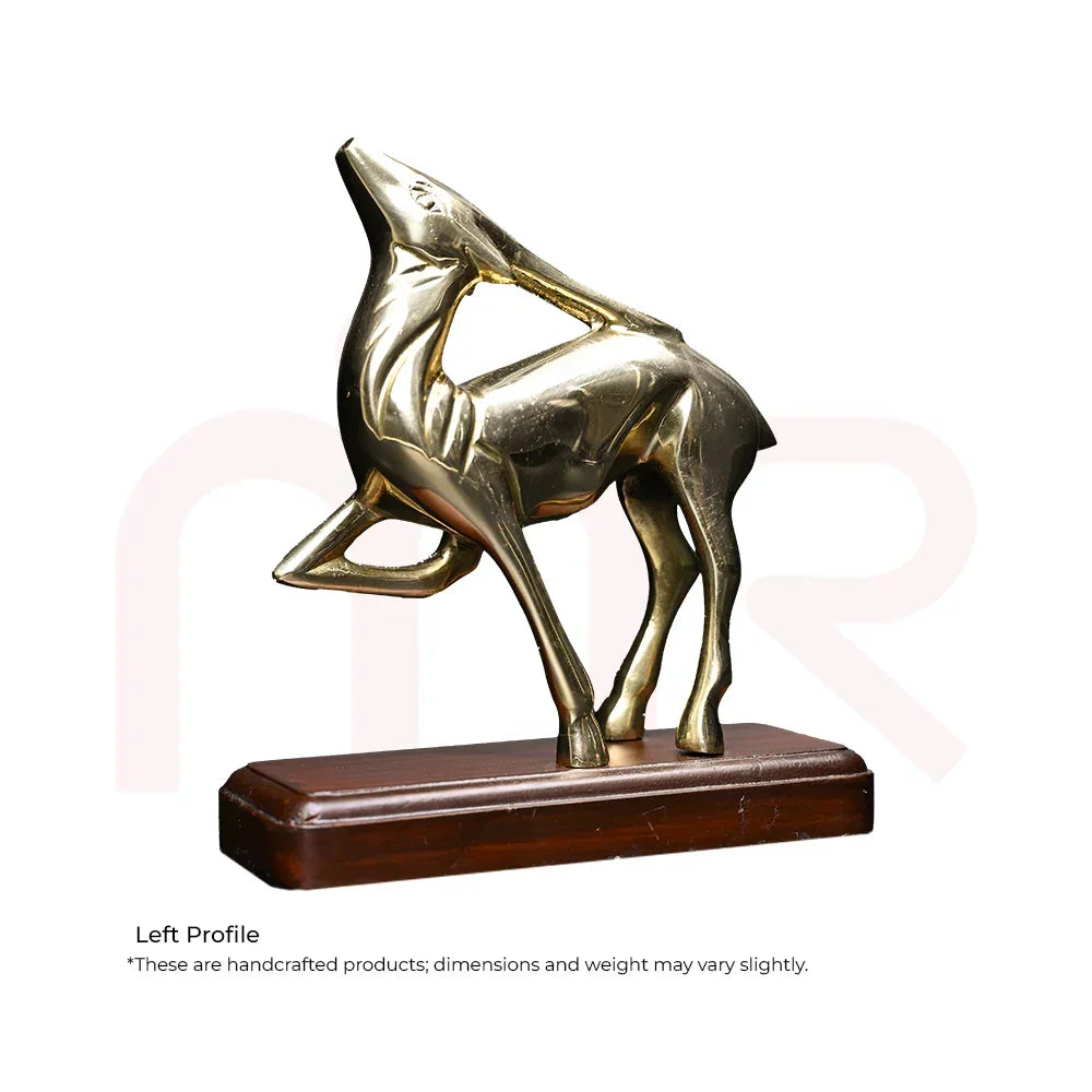 Brass deer figurine in leaping pose on a wooden base, Vastu decor for positivity
