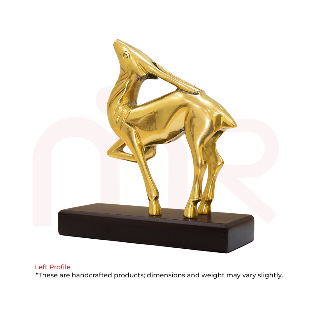 Brass deer figurine in leaping pose on a wooden base, Vastu decor for positivity