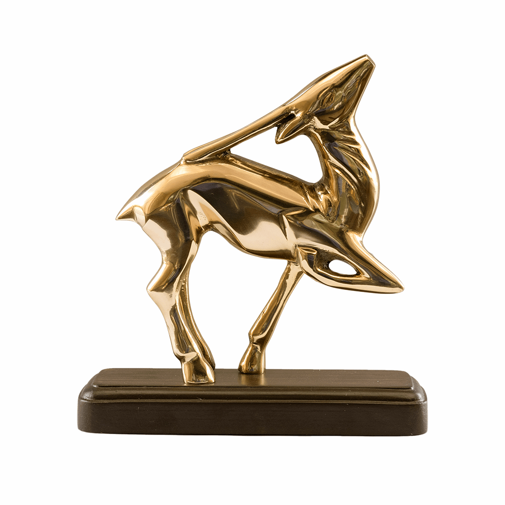 Brass Deer Showpiece, a maha vastu remedy, in an elegant leaping pose with it's face turned upwards. Deer Statue is standing on a wooden plank