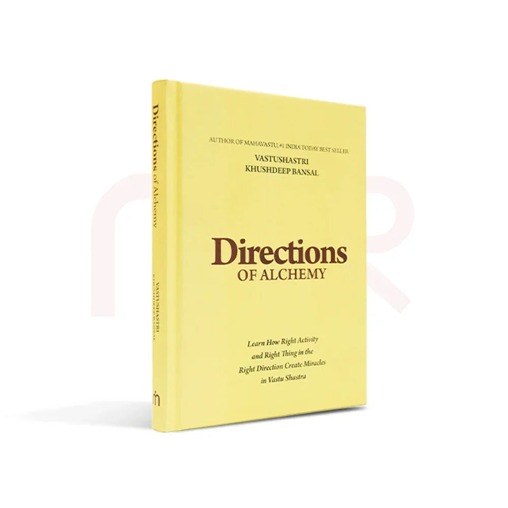 Directions of Alchemy book on Vastu Shastra remedies with yellow cover, standing upright