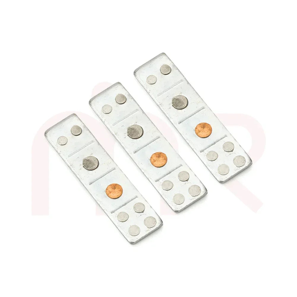 Three Vastu remedy metal strips with silver and copper dots on a white background