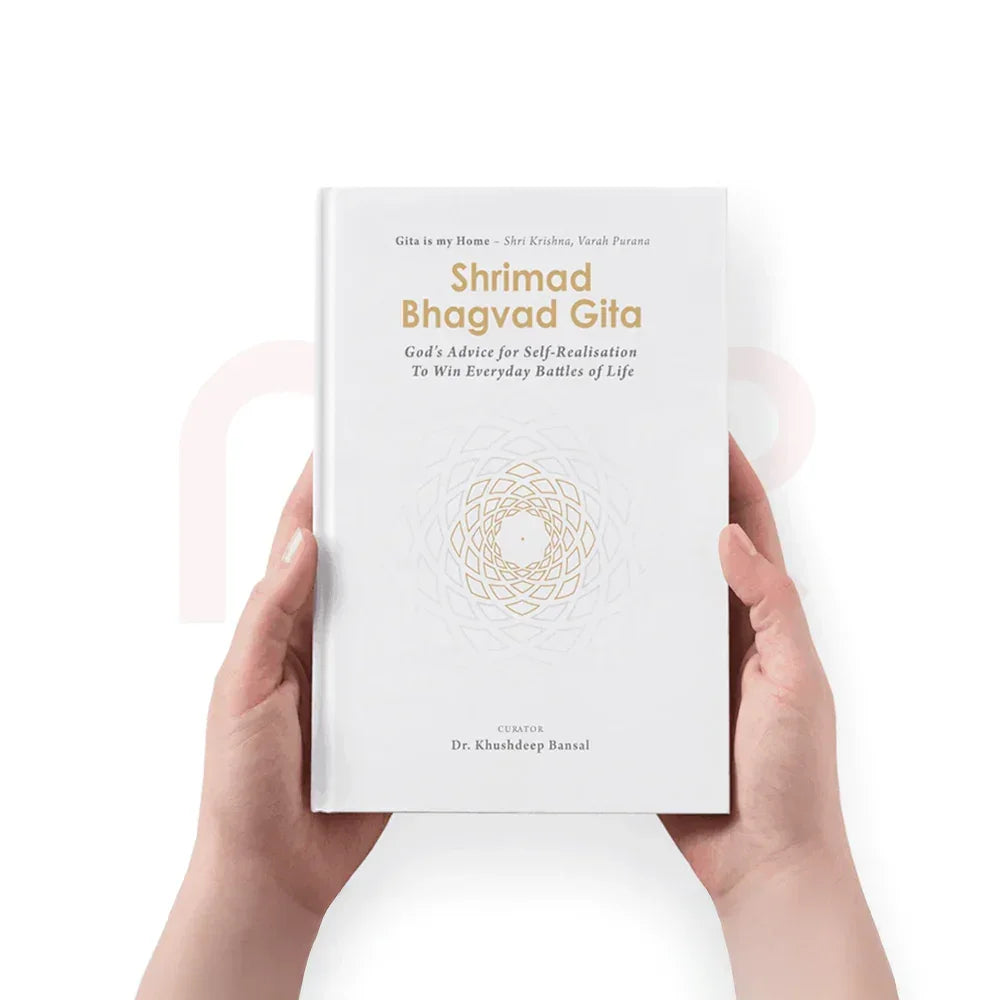 Hands holding Shrimad Bhagavad Gita book, white cover, Vastu remedy for positivity