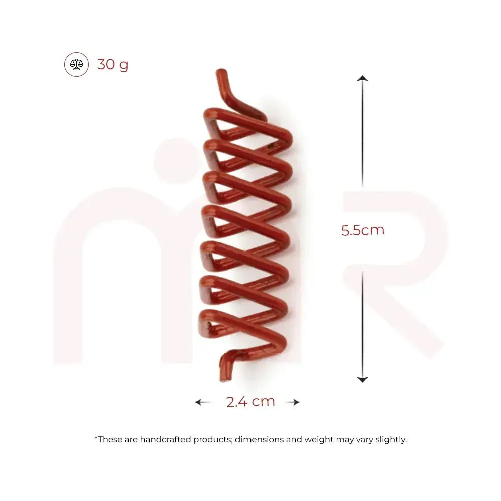Red Vastu metal strip remedy measuring 5.5cm in length and 2.4cm in width.