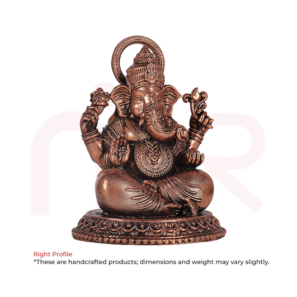 Handcrafted bronze Ganesh idol sitting, detailed Vastu remedy decor for positivity and prosperity