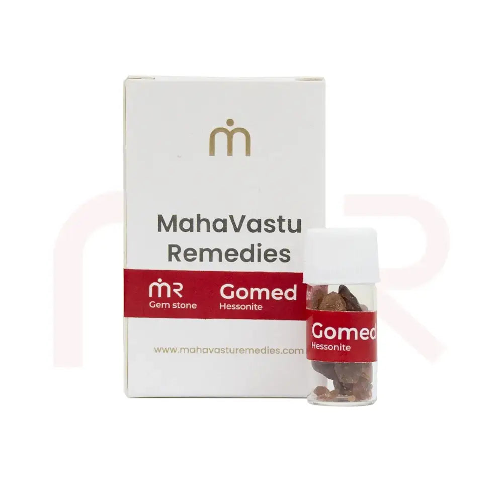 Gomed Hessonite gemstone pieces in a small vial with MahaVastu Remedies packaging.