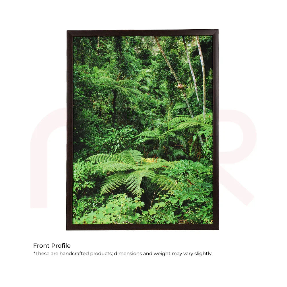 Green Vastu painting of lush jungle plants in a black frame for MahaVastu remedies.