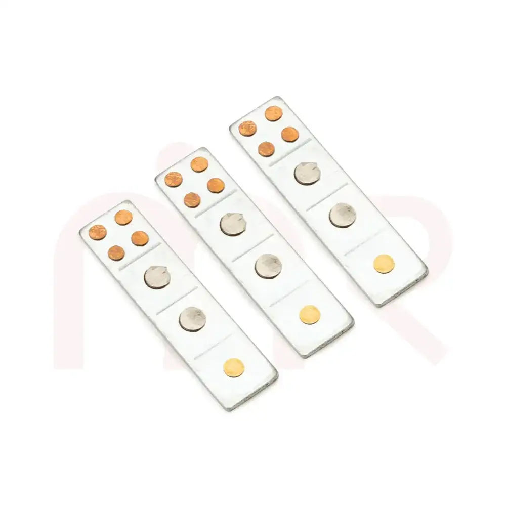 Three silver metal Vastu strips with copper and brass dots for energy balancing.