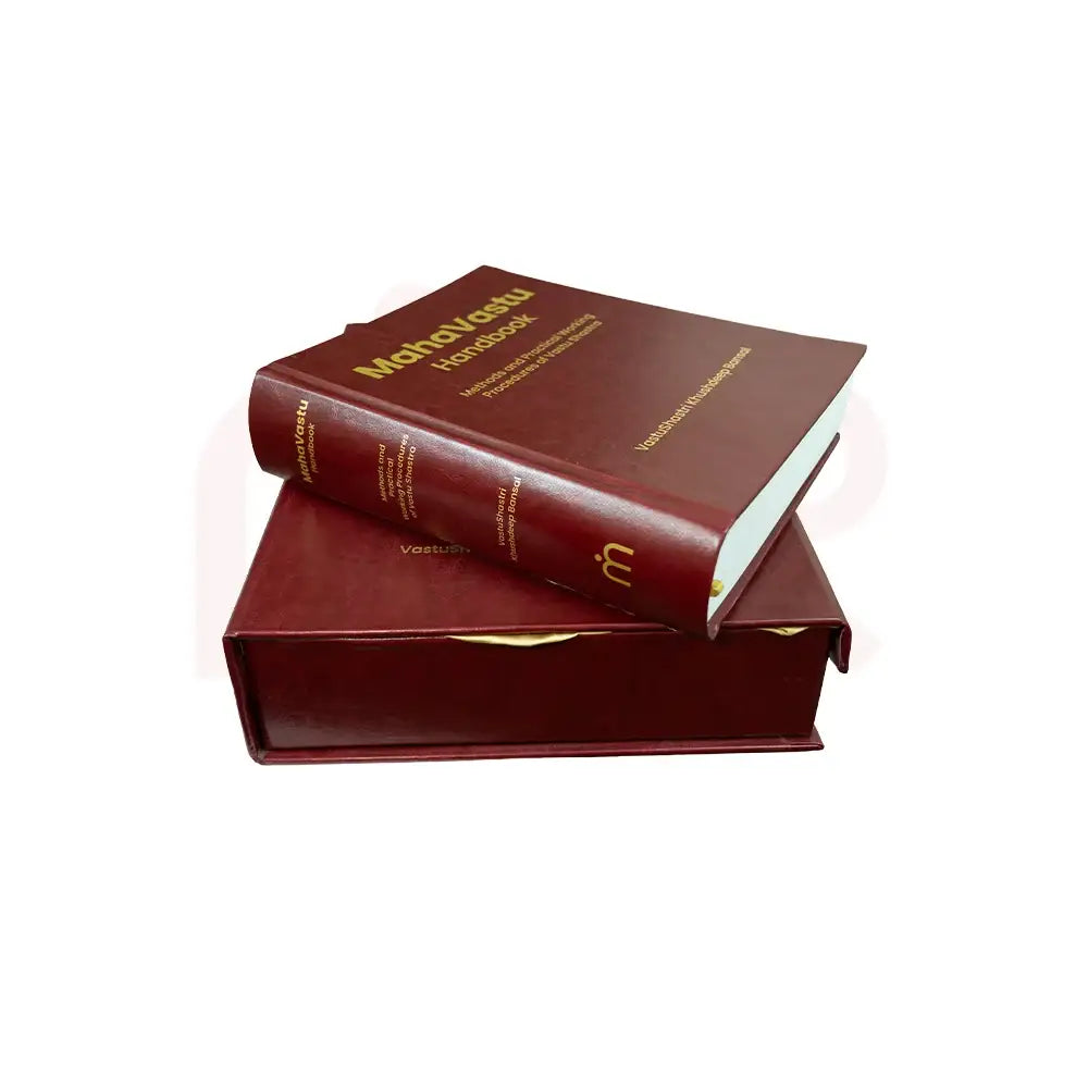 MahaVastu Handbook book on a dark red decorative box.