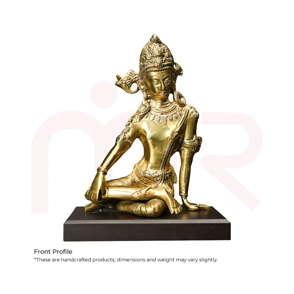Handcrafted brass deity idol sitting on black base, perfect for Vastu remedies and positivity.