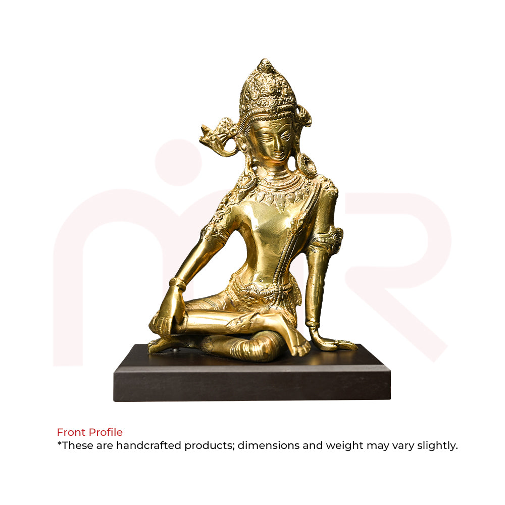 Handcrafted brass deity idol sitting on black base, perfect for Vastu remedies and positivity.