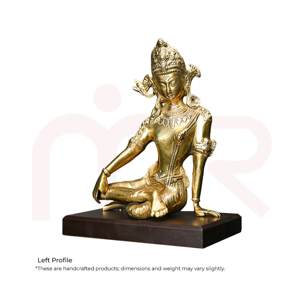 Handcrafted brass deity idol in meditation pose on black base, ideal for Vastu remedies and decor