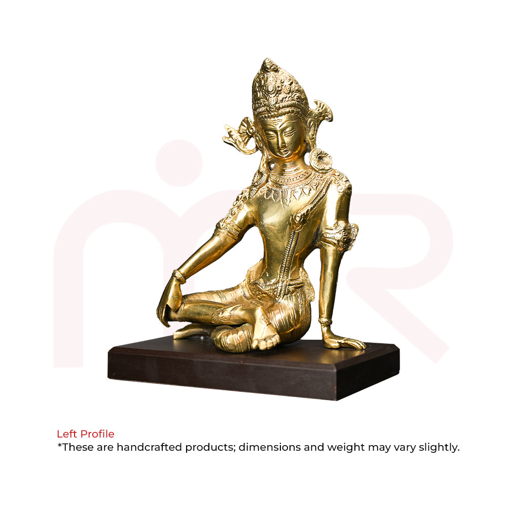 Handcrafted brass deity idol in meditation pose on black base, ideal for Vastu remedies and decor