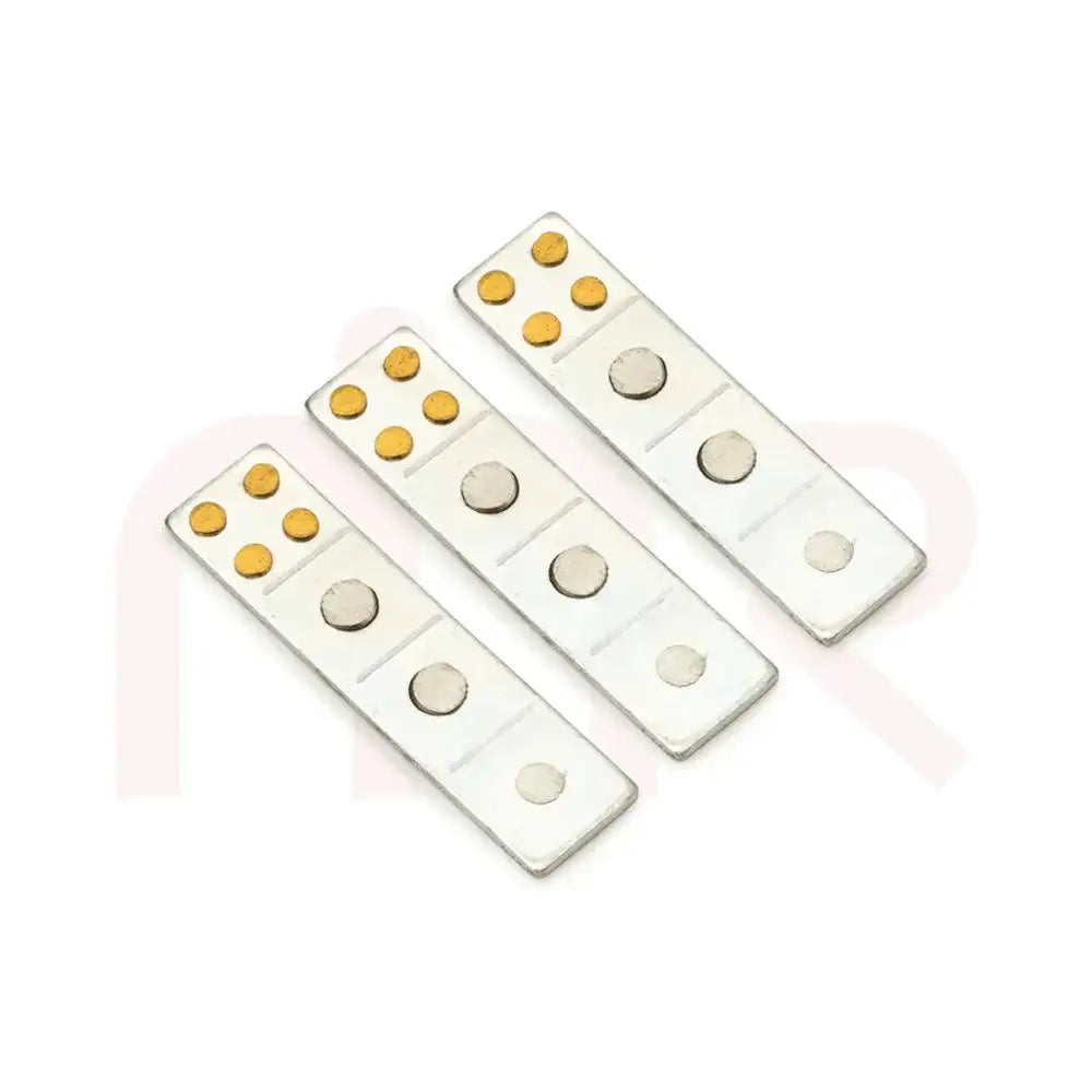 Three silver metal strips with gold dots for Vastu Shastra remedies
