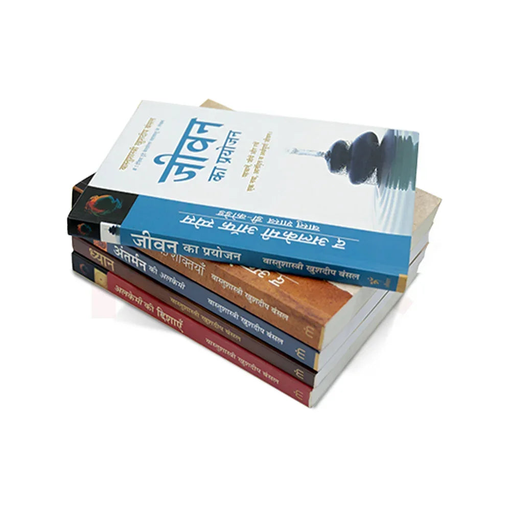 Stack of Hindi Vastu Shastra remedy books on white background