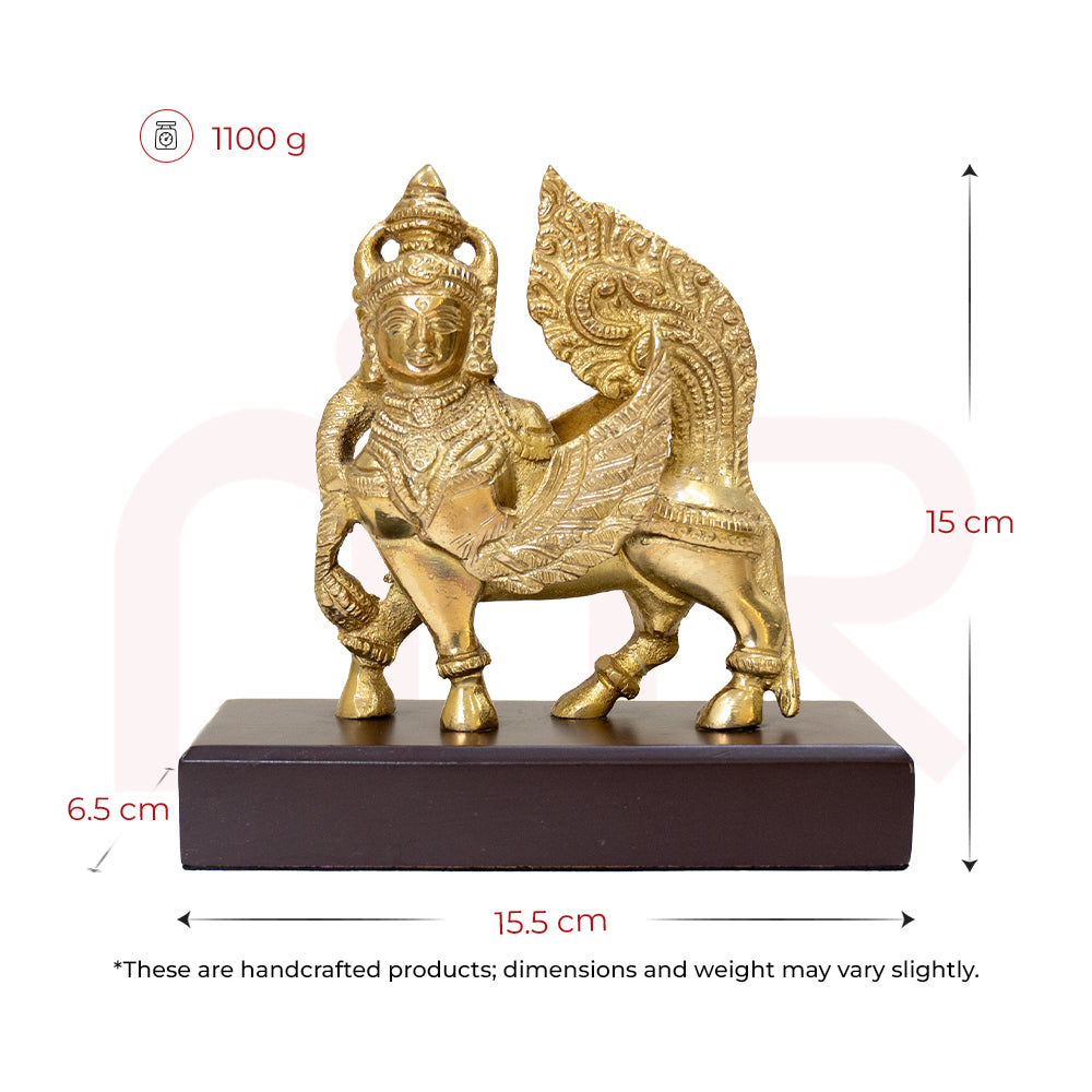Brass Kamdhenu cow idol for Vastu, ornate design on wooden base, 15.5 cm wide, 15 cm tall