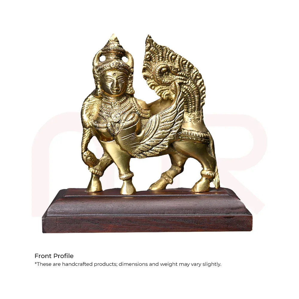Brass Kamdhenu cow Vastu idol with intricate detailing on wooden base