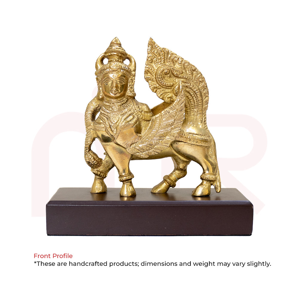 Brass Kamdhenu cow Vastu idol with intricate detailing on wooden base