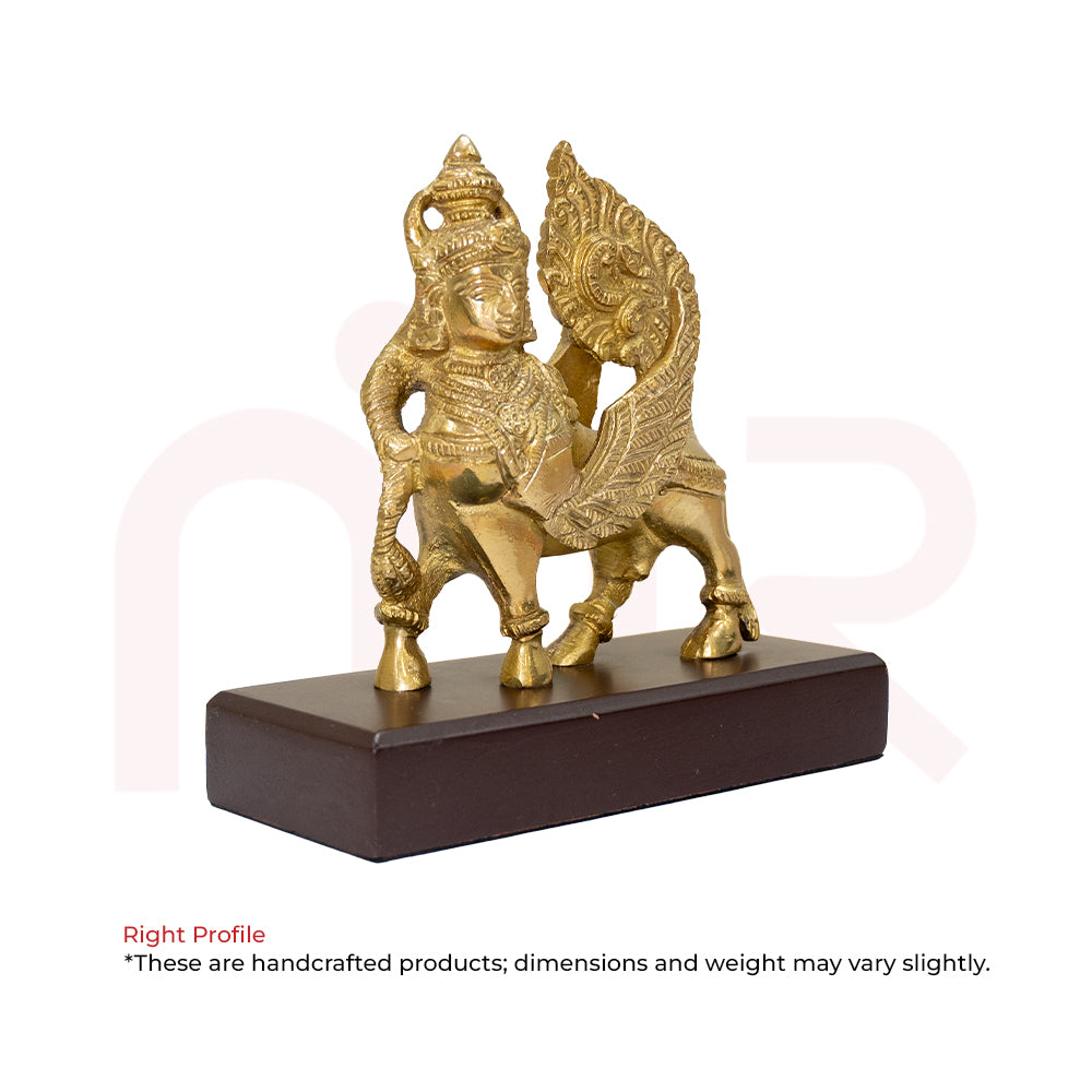 Brass Kamdhenu cow idol with ornate detailing on wooden base, Vastu remedy decor
