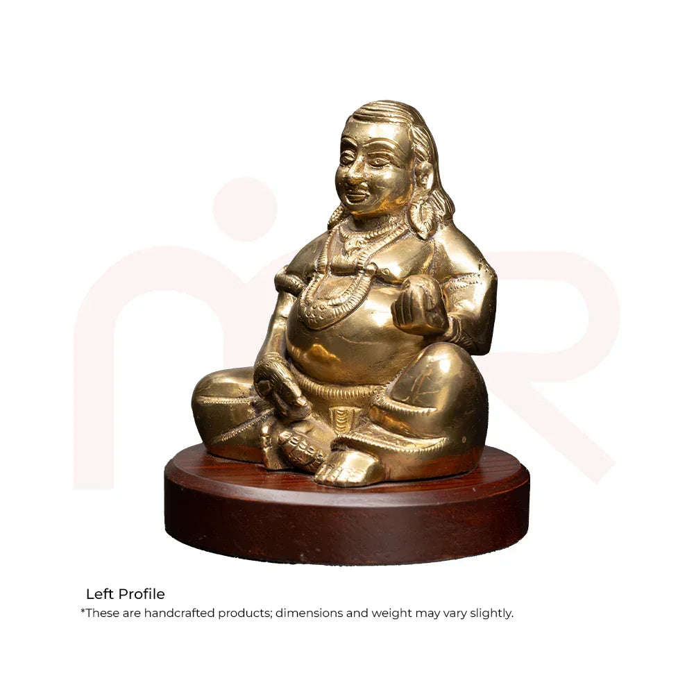 Brass Kuber idol sitting on a wooden base, ideal for Vastu and MahaVastu remedies.