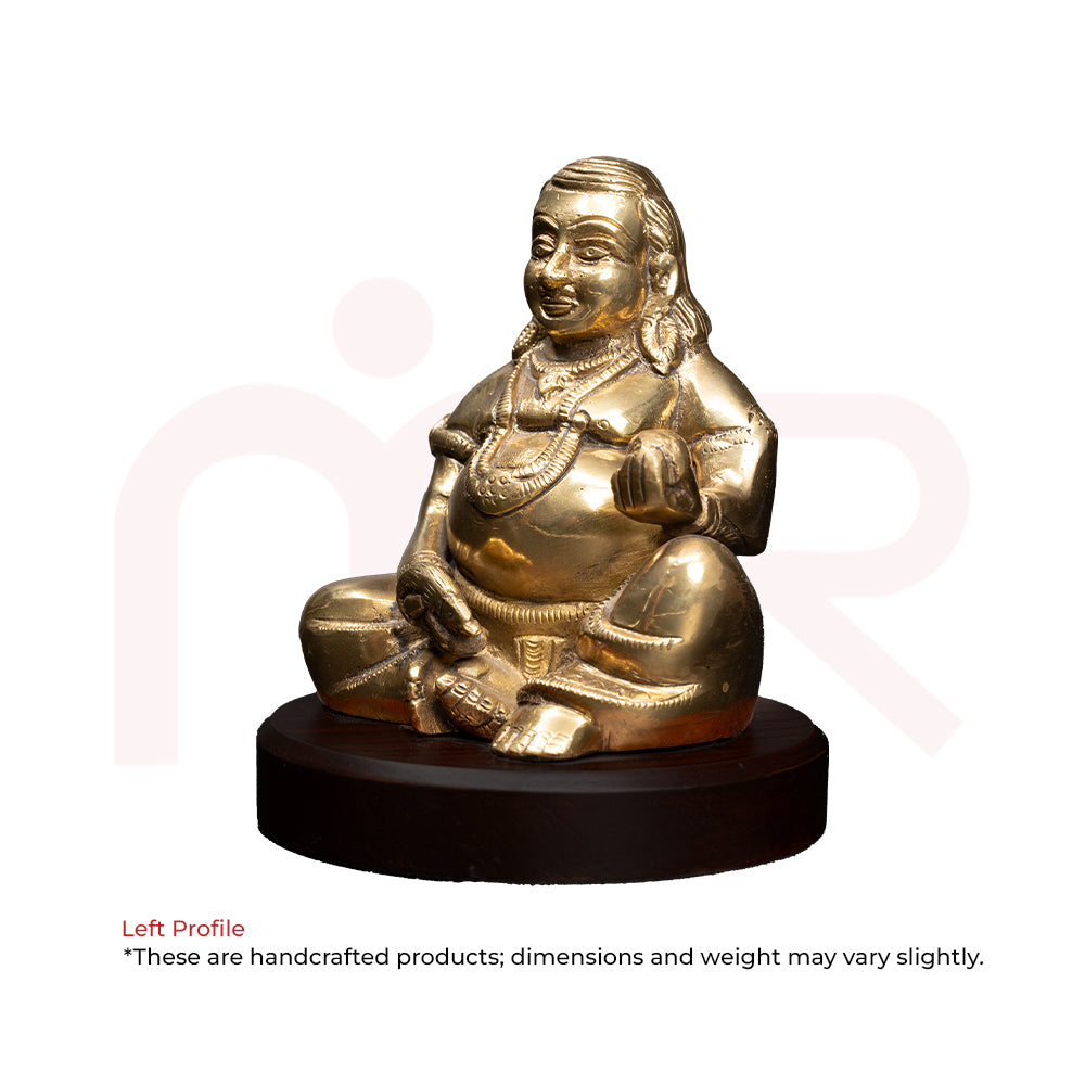 Brass Kuber idol sitting on a wooden base, ideal for Vastu and MahaVastu remedies.