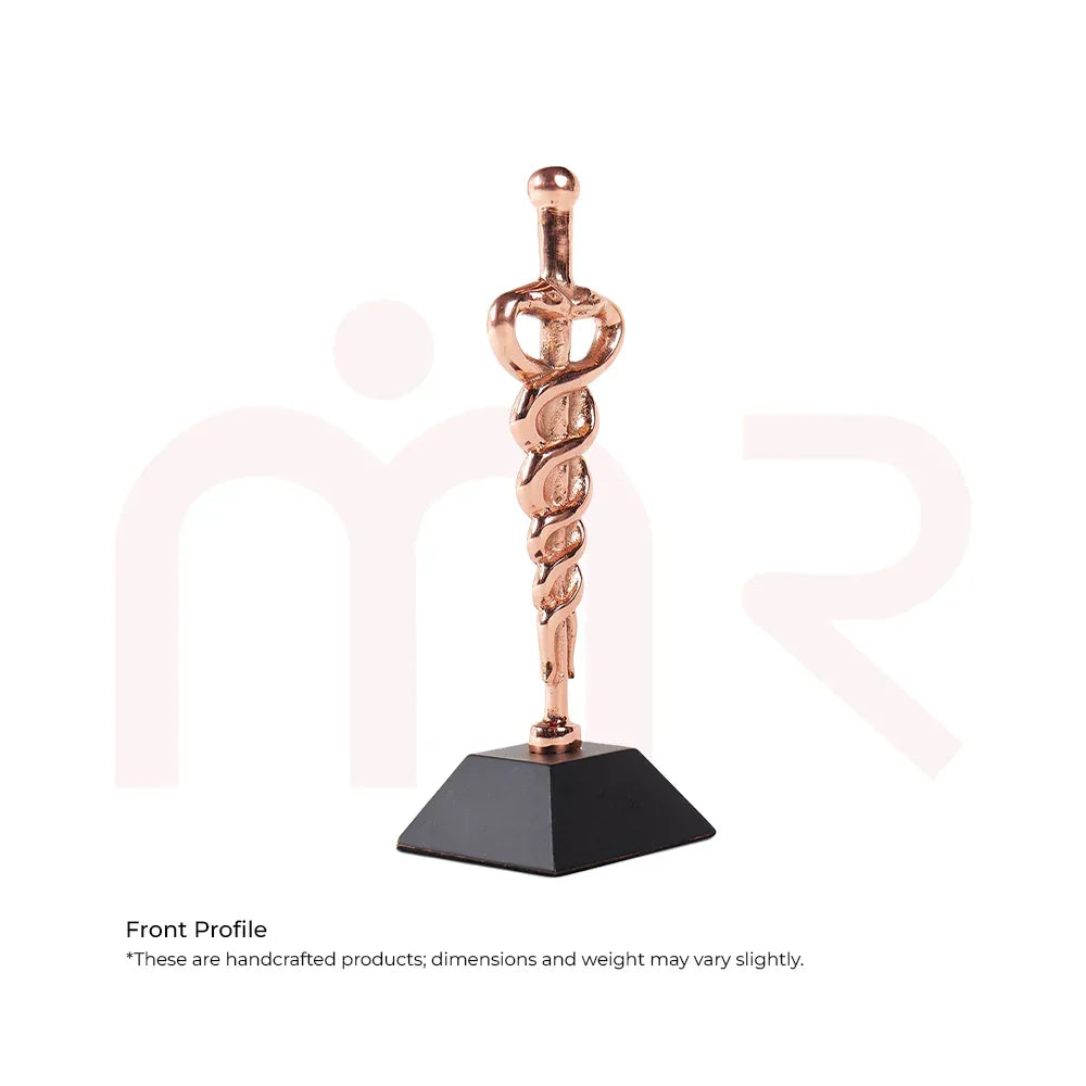 Copper Kundalini energy remedy sculpture with coiled serpent on black base for Vastu balance
