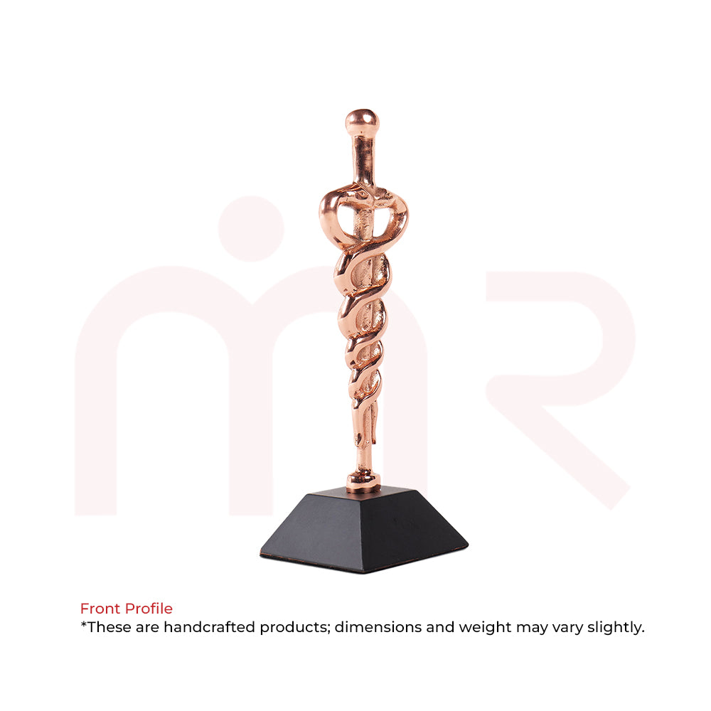 Copper Kundalini energy remedy sculpture with coiled serpent on black base for Vastu balance