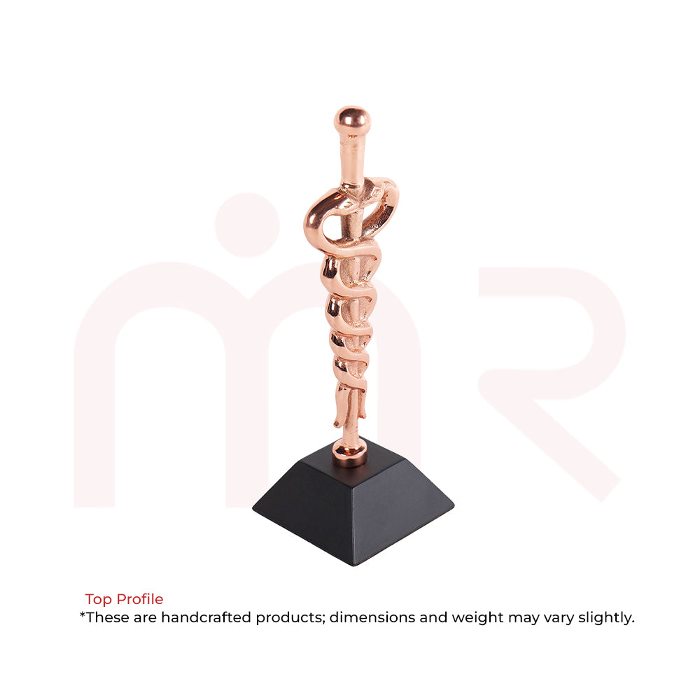 Copper Kundalini Vastu remedy sculpture with snake design on black pyramid base