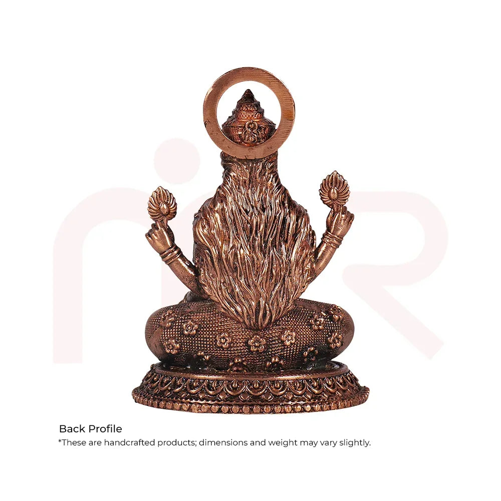 Back view of handcrafted bronze goddess idol on ornate base, Vastu Shastra home remedy decor
