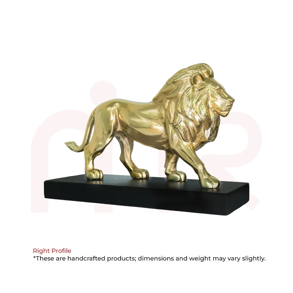 Golden lion statue on a black base for Vastu prosperity and positive energy.