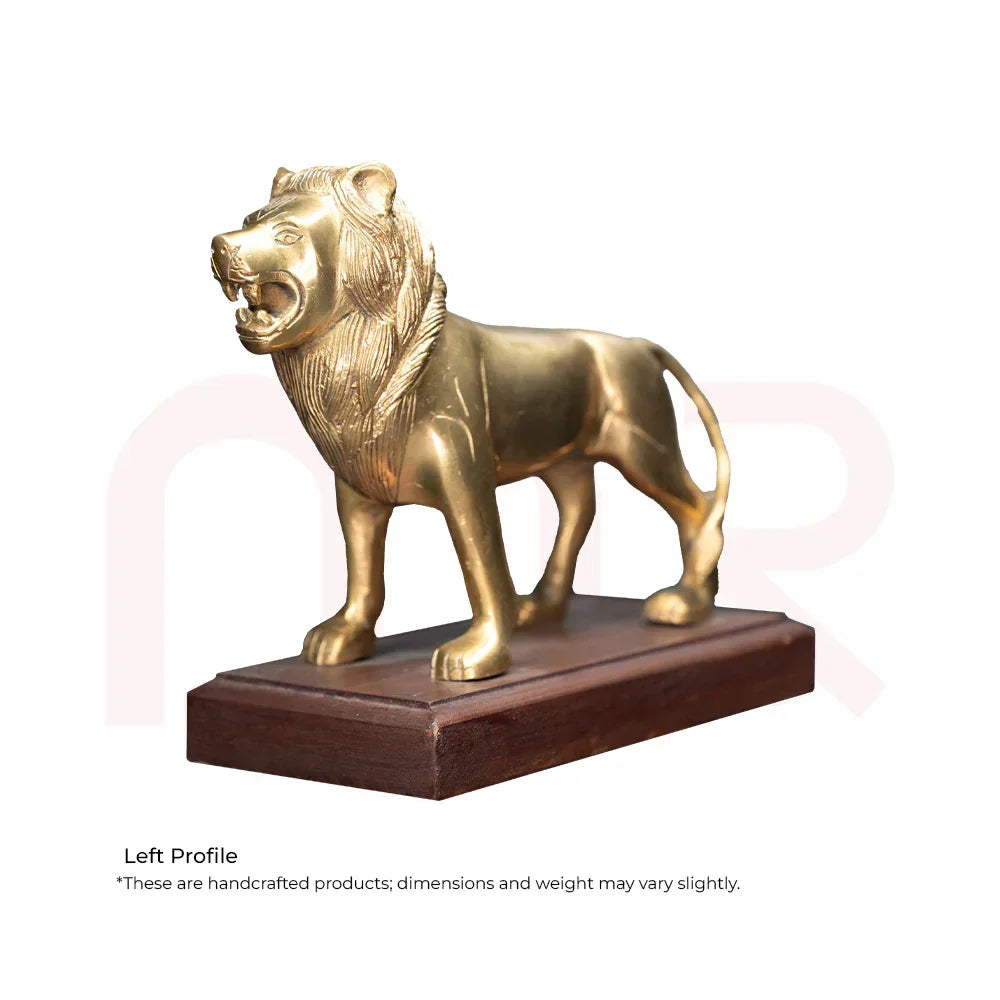 Brass lion statue for Vastu remedy on wooden base, symbolizing strength and protection.