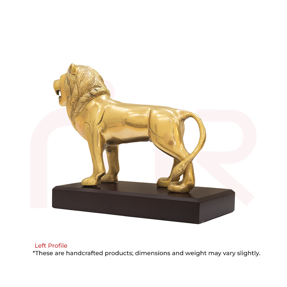 Brass lion statue for Vastu remedy on wooden base, symbolizing strength and protection.