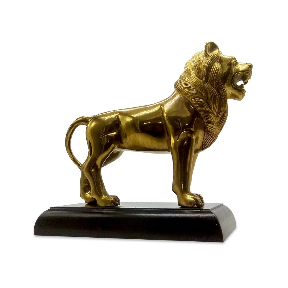 Golden brass statue of a lion, a vastu item for home, in mid-roar with a detailed mane, standing on a black base, captured in profile view